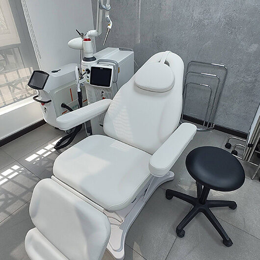 Close-up of laser treatment chair and equipment at Femiclinic in Dubai Healthcare City