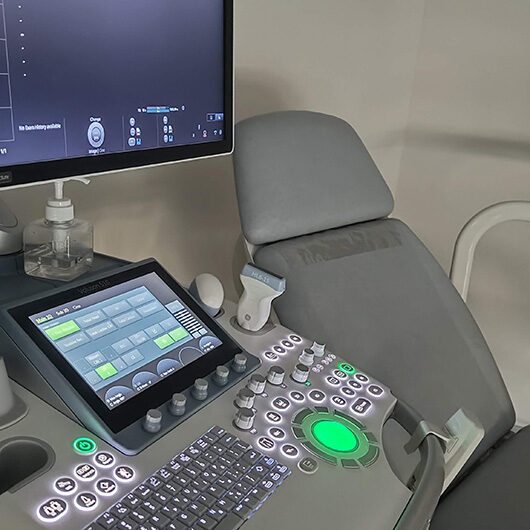 State-of-the-art ultrasound equipment in a dedicated examination room at Femiclinic in Dubai Healthcare City.